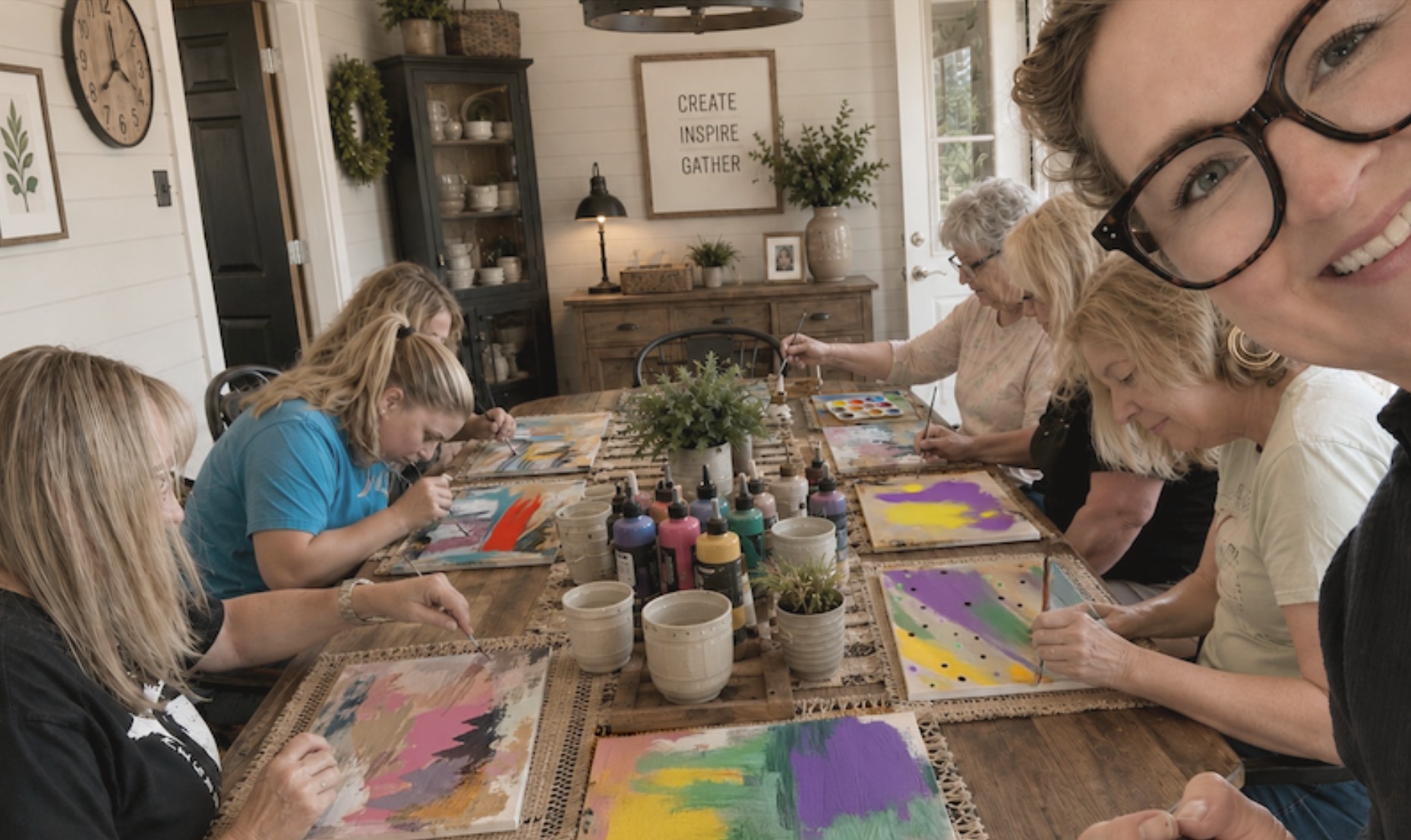 Adults creating together around a table